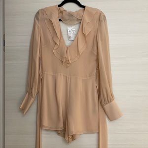 Light pink romper by intermix. Never been worn